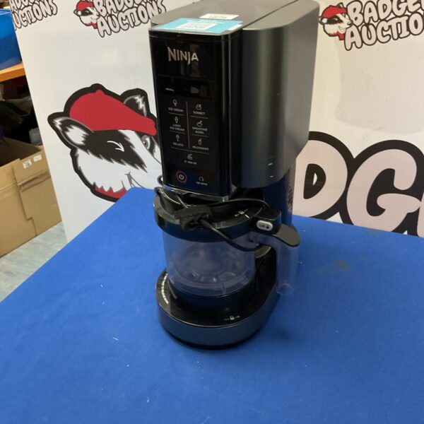 Black Ninja Creami ice cream maker with control panel.