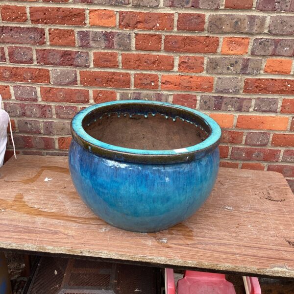 Large blue and green glazed garden planter for outdoor use.
