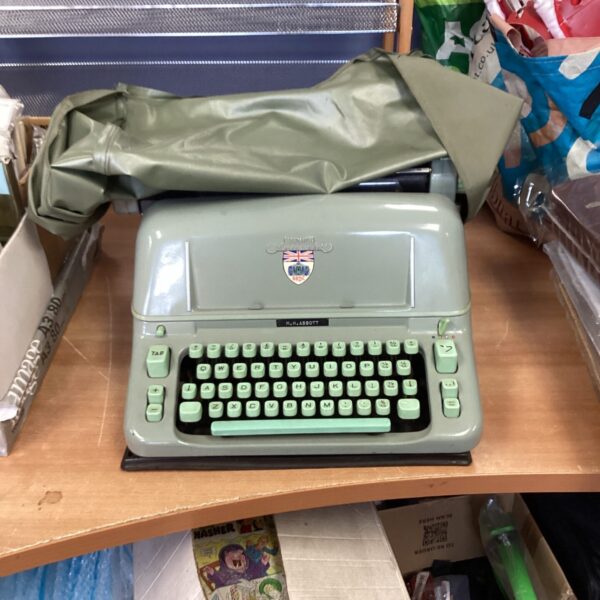 Vintage Hermes Ambassador typewriter with British Racing Drivers Club branding.
