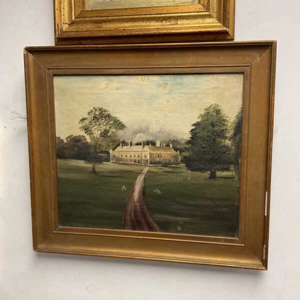 Antique oil painting of a manor house with a gilt frame.