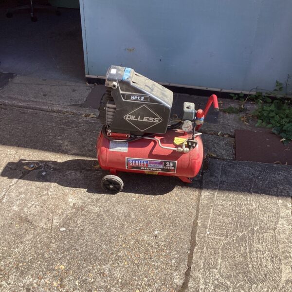 Portable Sealey air compressor in used condition, ideal for garage use.