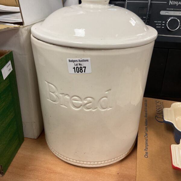 White ceramic bread bin for kitchen storage.