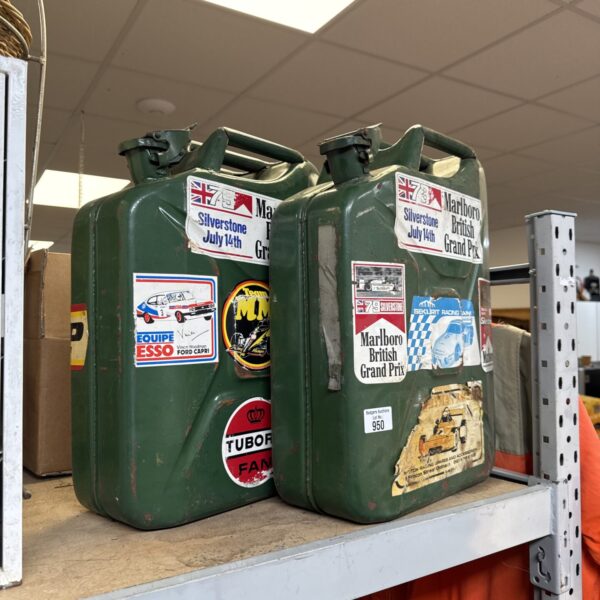 Vintage jerry cans with motorsport stickers, including Silverstone.