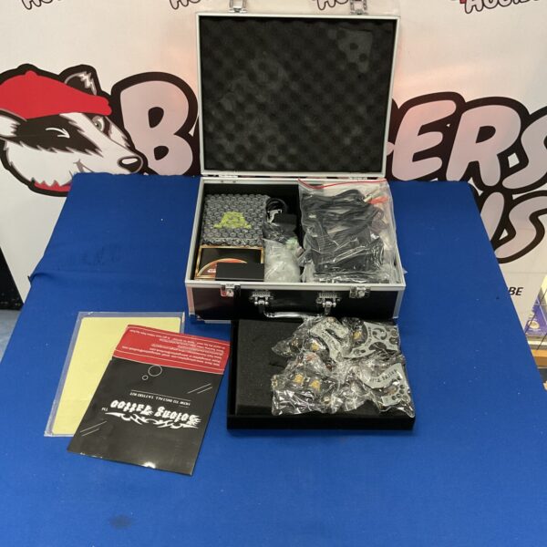 Solomg tattoo kit with carrying case and tattoo pen.