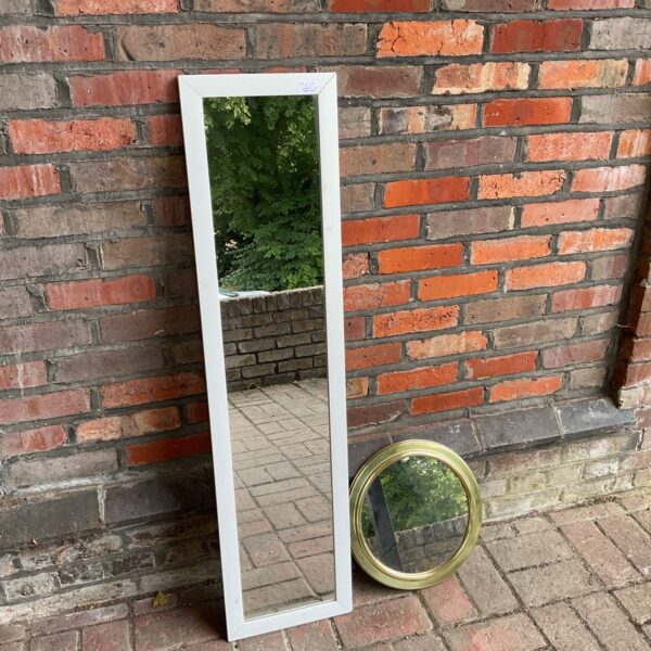 Large white framed bedroom mirror for home decor.