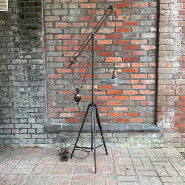 Vintage architect floor lamp with tripod base and adjustable arm.