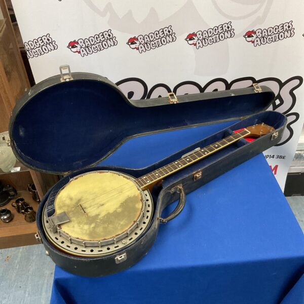 Vintage Kay banjo in its original transit case.