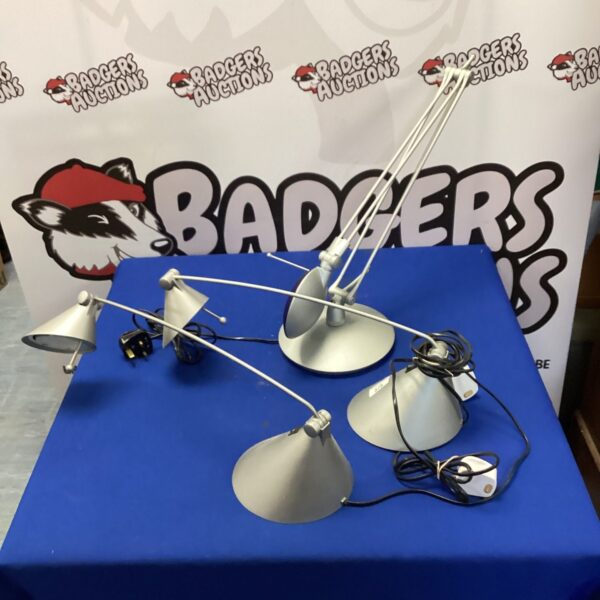 Three vintage adjustable desk lamps with chrome finish.