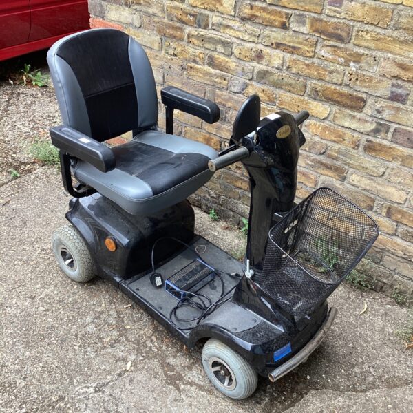 Blue Freedom electric mobility scooter with adjustable seat and tiller.