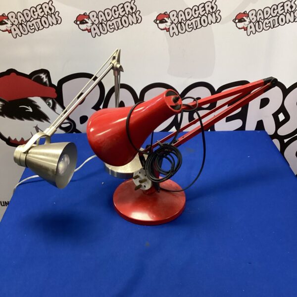 Red vintage Anglepoise lamp with adjustable arm.