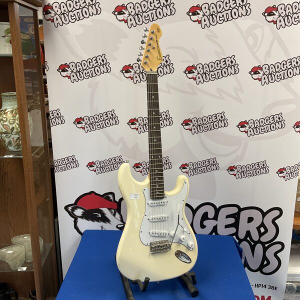 White Encore Blaster Series electric guitar, vintage instrument.