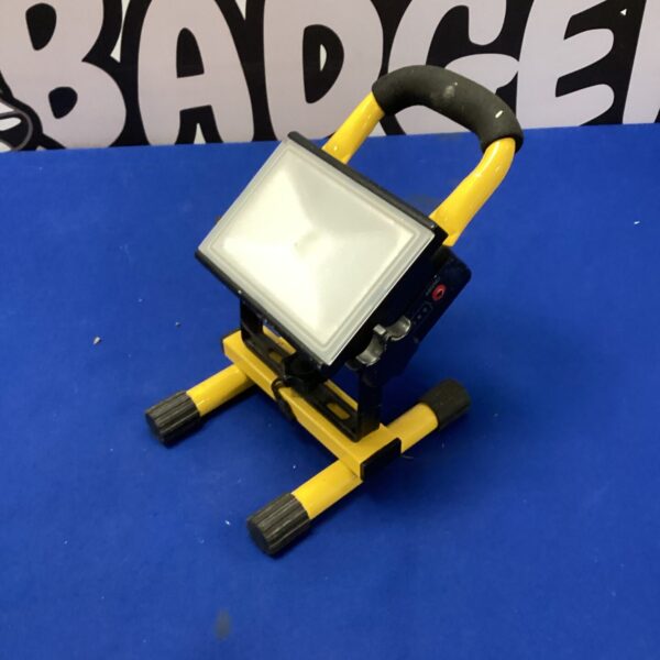 Portable LED site light with folding stand for construction and DIY.