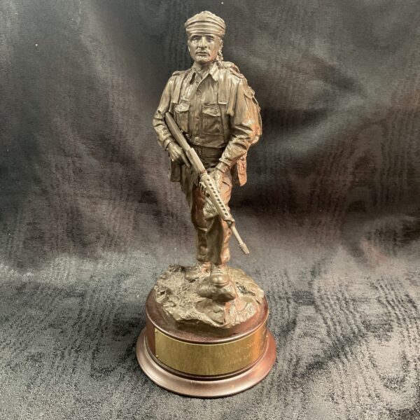 Front view of a bronzed Sultan's Special Forces statue.