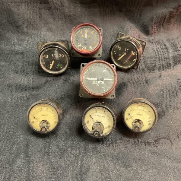 Vintage WWII aircraft instruments, a collection of gauges.