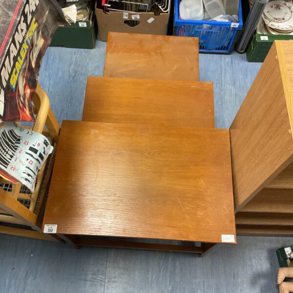 Vintage oak nesting tables, a classic furniture set.