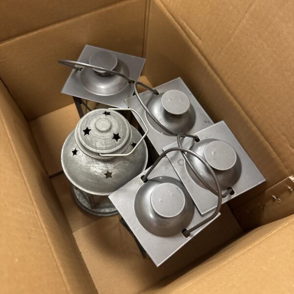 Lot of five metal tea light lanterns with handles.