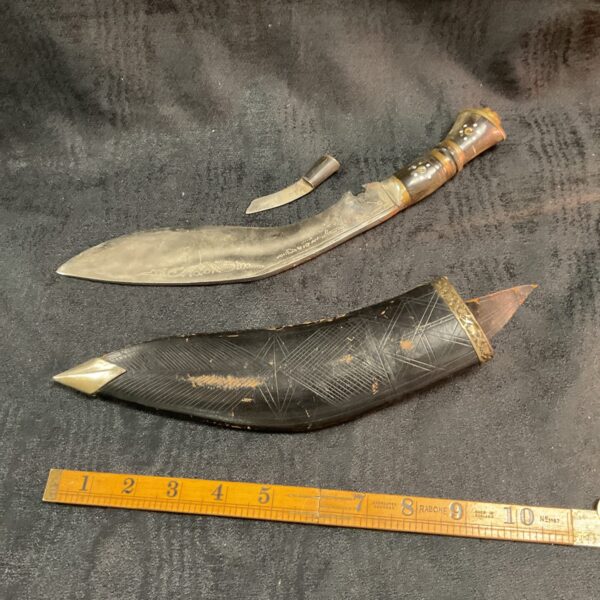 Traditional Indian Kukri ceremonial knife with carved handle.