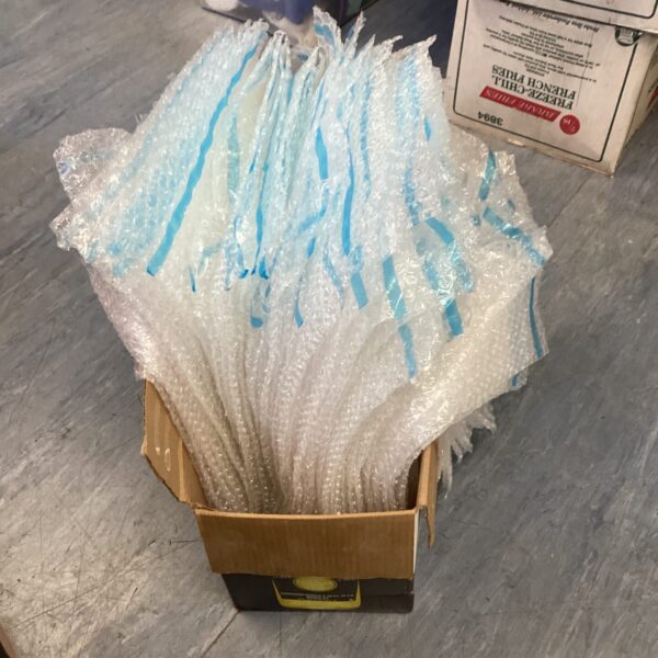 Stack of bubble wrap envelopes ready for shipping and packaging.