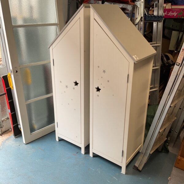 Painted under stairs cupboards with star decoration, vintage style.