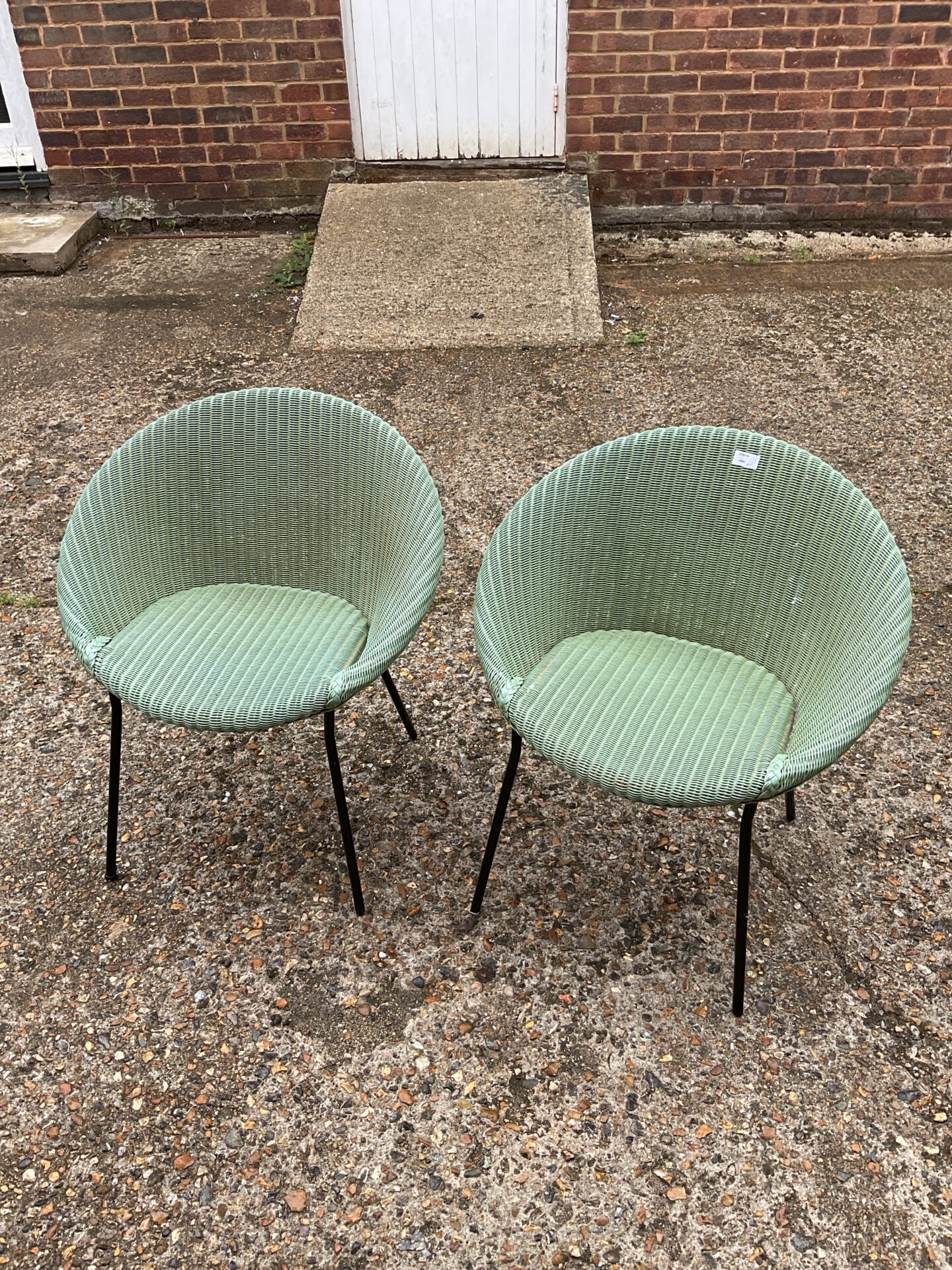 1034 Pair of lloyd loom style tub chairs