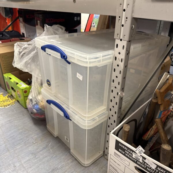Two white plastic storage tubs stacked, ideal for home organisation.