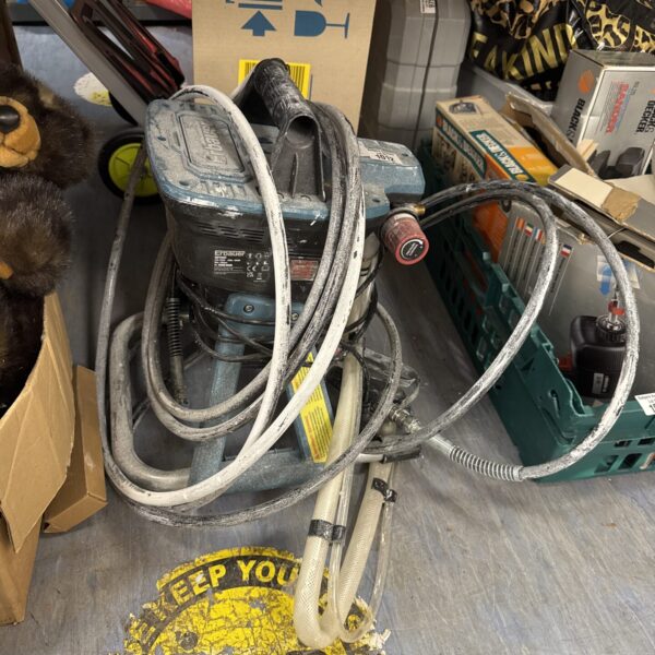 Erbauer EAPS600 paint sprayer with hoses and attachments.