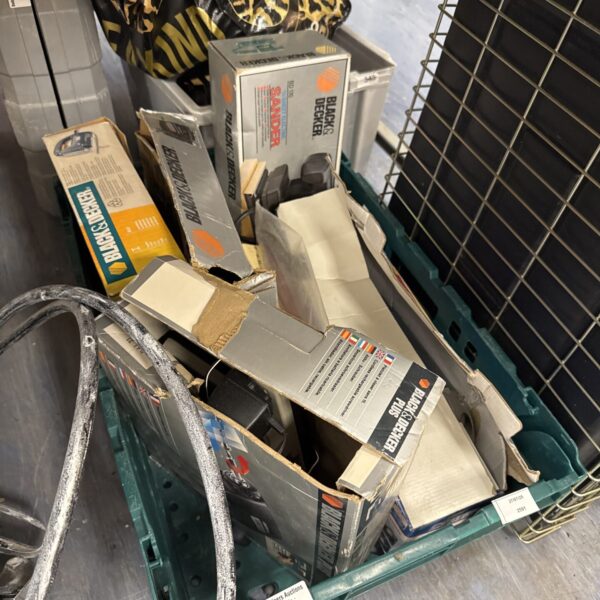 Assorted Black & Decker tools in original packaging.