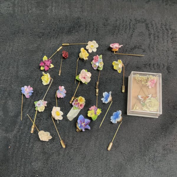 Vintage lot of floral stick pins and earrings for collectors.