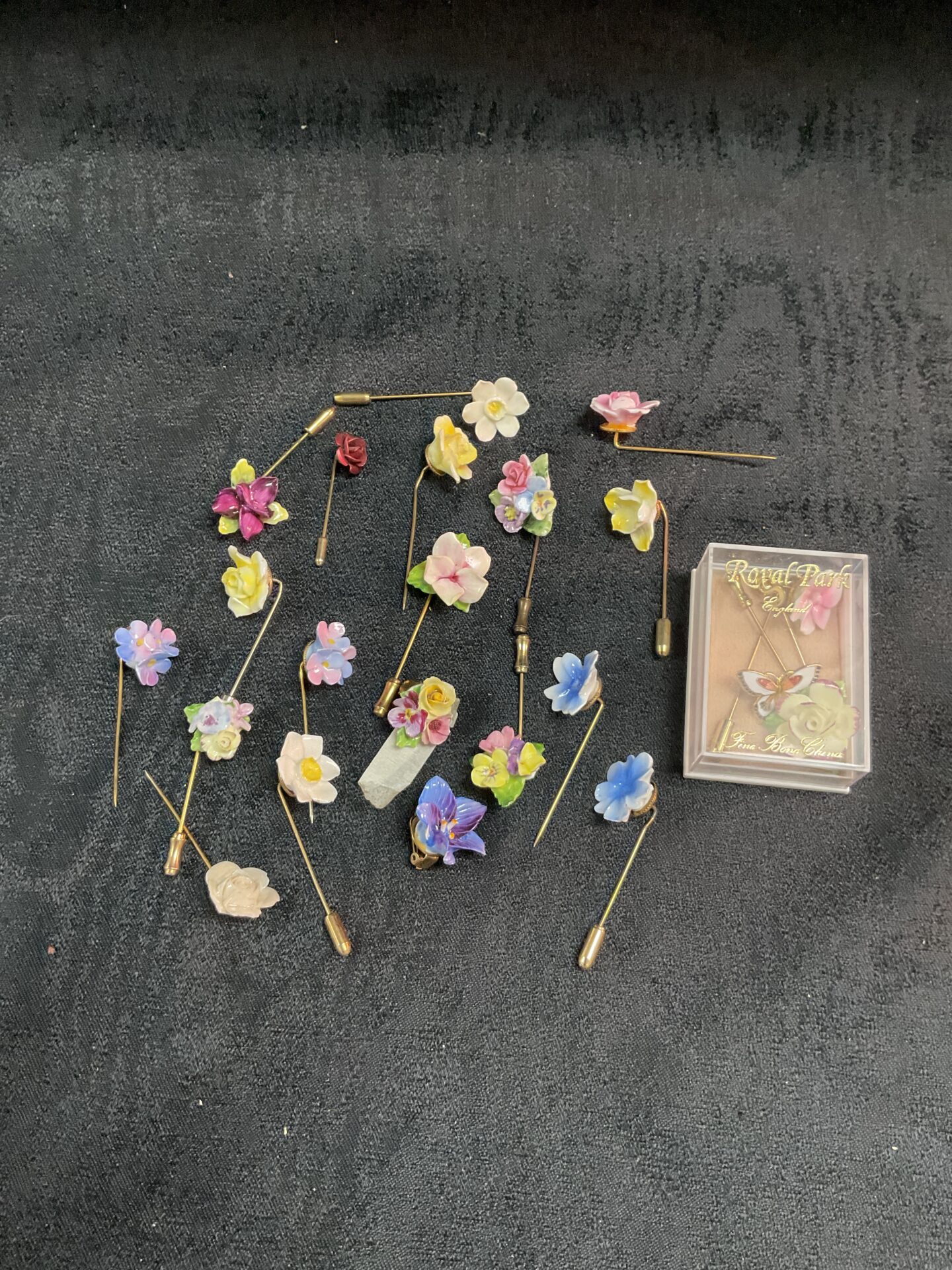 713 Twenty Floral stick pins and two earrings