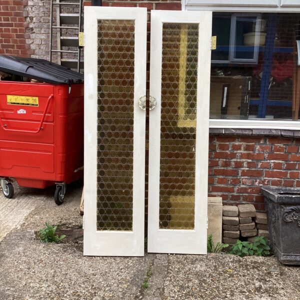 Pair of vintage retro internal doors with geometric glazing.