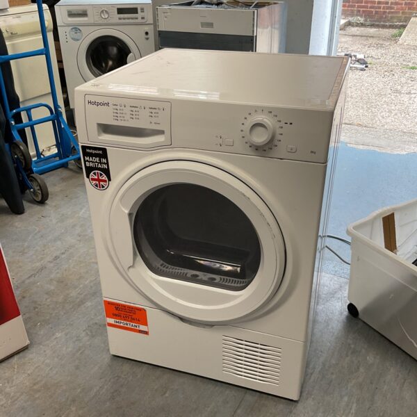 White Hotpoint 8kg condenser tumble dryer for laundry.