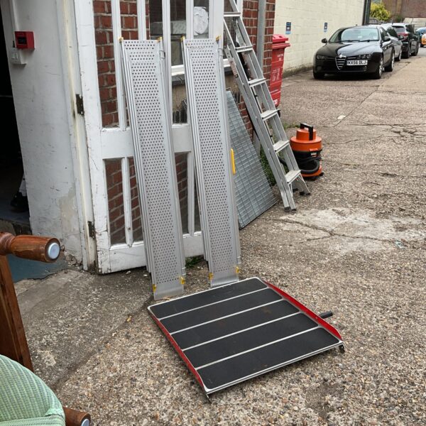 Set of aluminium extending access ramps for loading or accessibility.