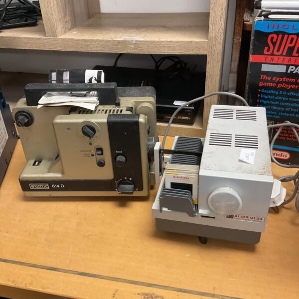 Vintage Eumig 614d and Aldis Qi 24 projectors for film and slides.