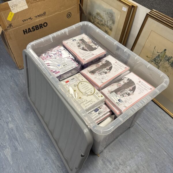 Large lot of new anniversary and greetings cards in plastic storage box.
