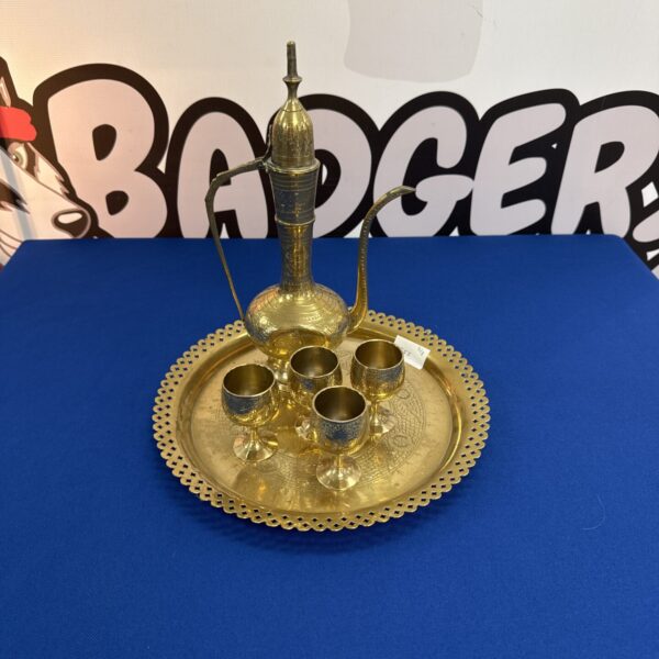 Vintage Moroccan coffee service set with brass tray and cups.