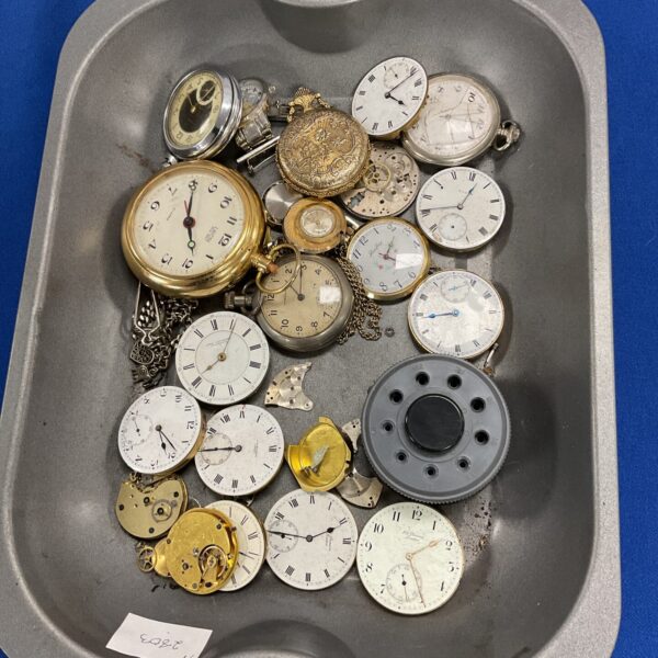 Tray of vintage watches and watch parts for collectors.