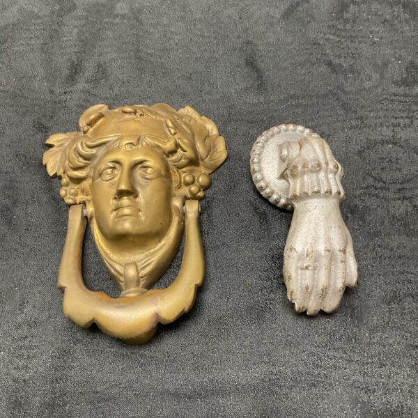 Vintage brass door knocker depicting a Greek goddess head.