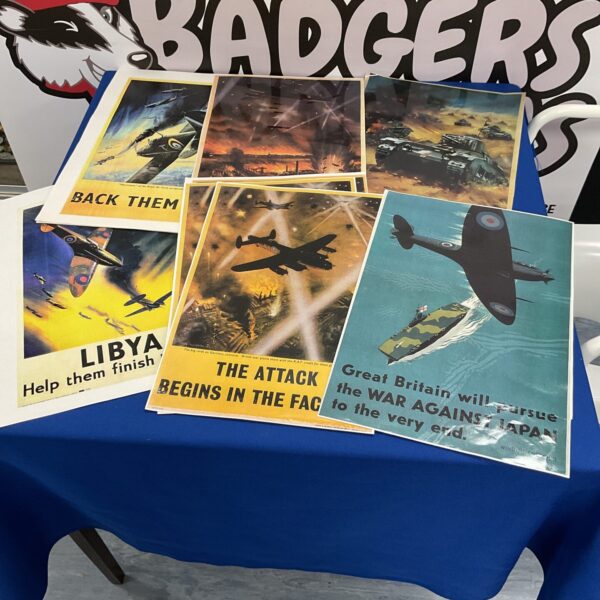 Lot of reproduction WWII wartime posters featuring aircraft designs.