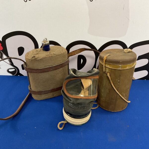 WWII water canteen and gas mask set, vintage military collectibles.