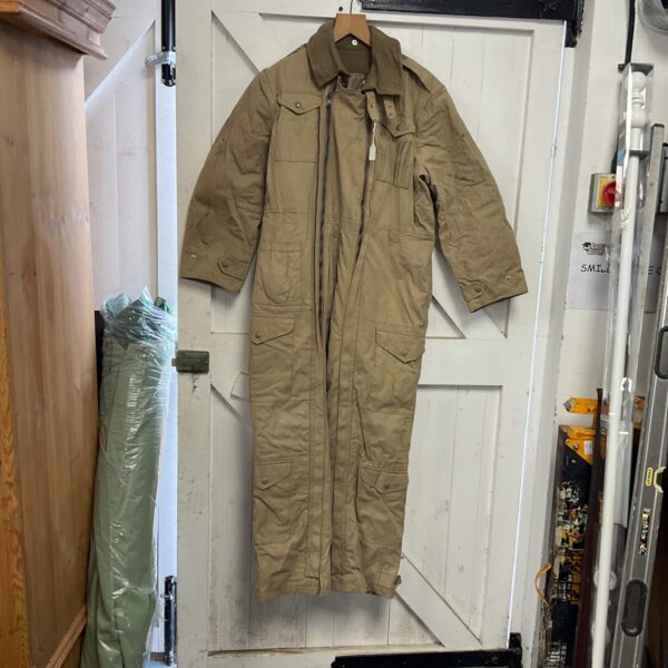 Vintage 1957 British desert tank crew oversuit hanging on a door.