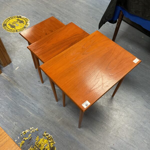 Vintage teak nest of tables set, mid-century modern style.