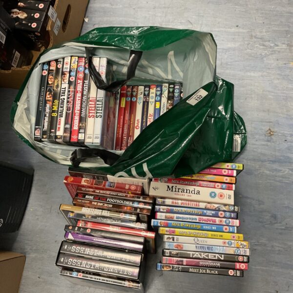DVD bundle with box sets and various movie titles.