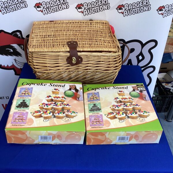 Vintage wicker basket with two tiered cupcake stands for serving.