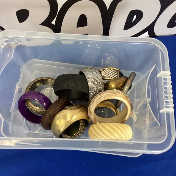 Mixed metal costume jewellery bangles in a storage box.