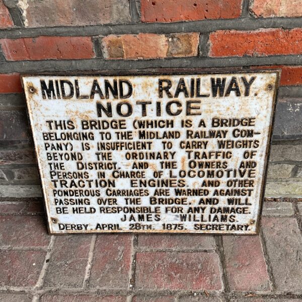 Vintage Midland Railway sign with weight restriction notice.