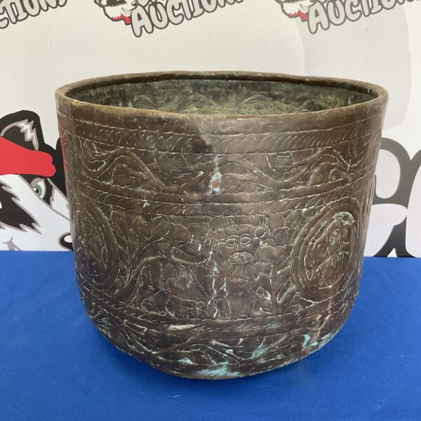 Vintage Persian copper planter with hammered detailing.