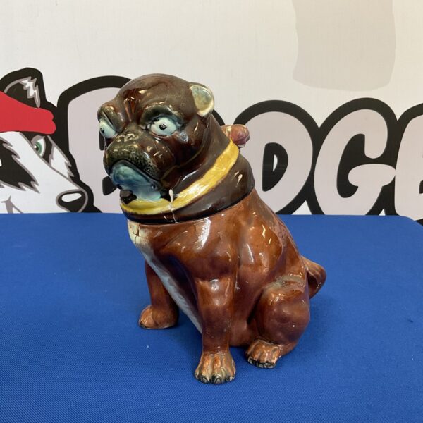 Antique ceramic tobacco jar shaped like a dog.