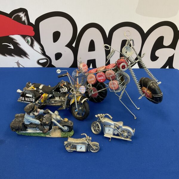 Vintage tin motorcycles with royal biker clocks, collectible retro toys.