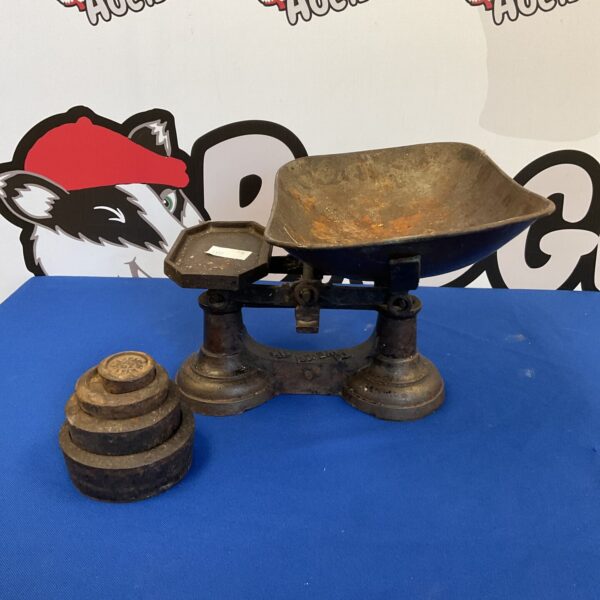 Antique William Cross scales with brass weights for accurate measurement.