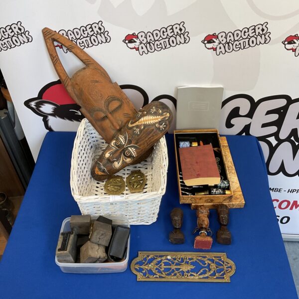 Lot of African carvings and vintage printers blocks for collectors.